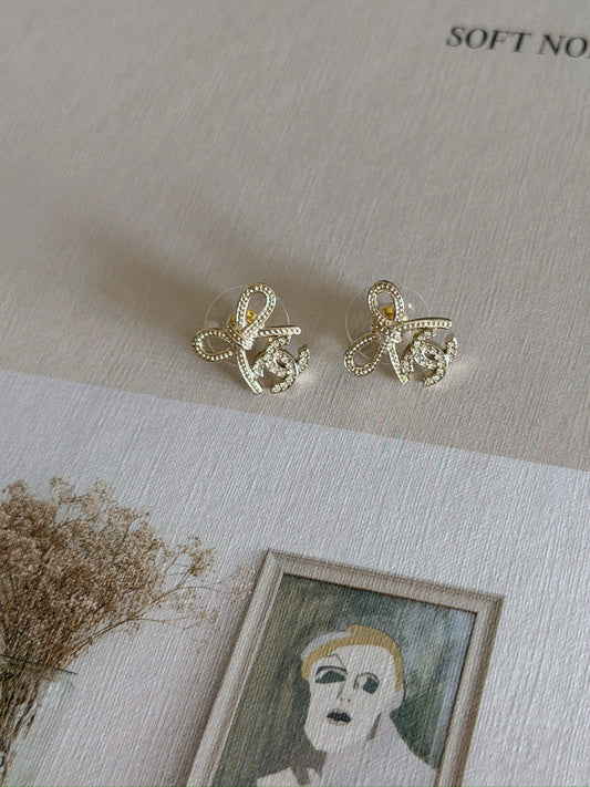 Chanel | 25K 蝴蝶結雙C耳環 淡金色